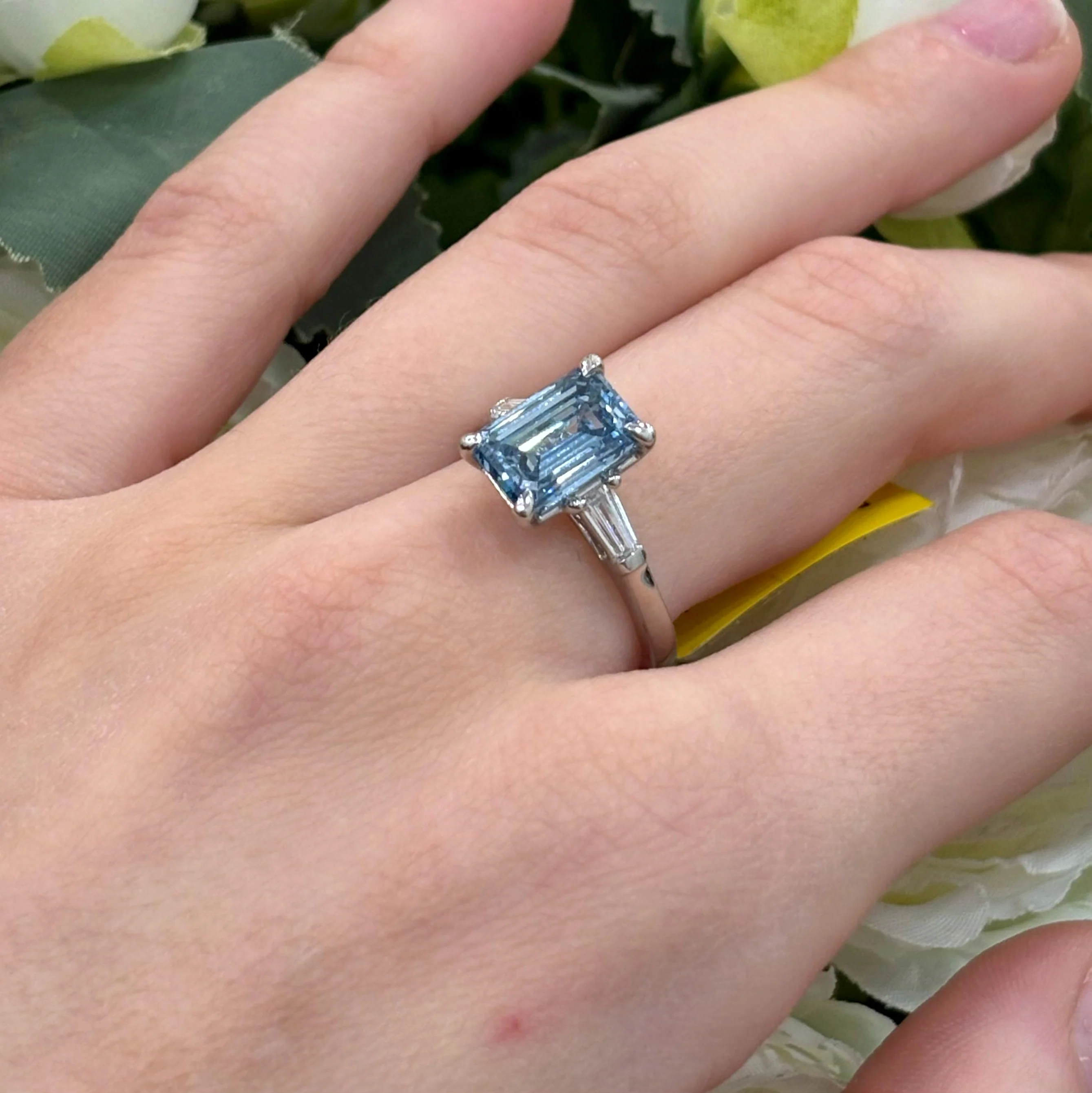 3.70 Carat IGI Lab Fancy Vivid Blue Emerald & Side Tapper Baguette Diamond Three-Stone Ring In Platinum - Image 2